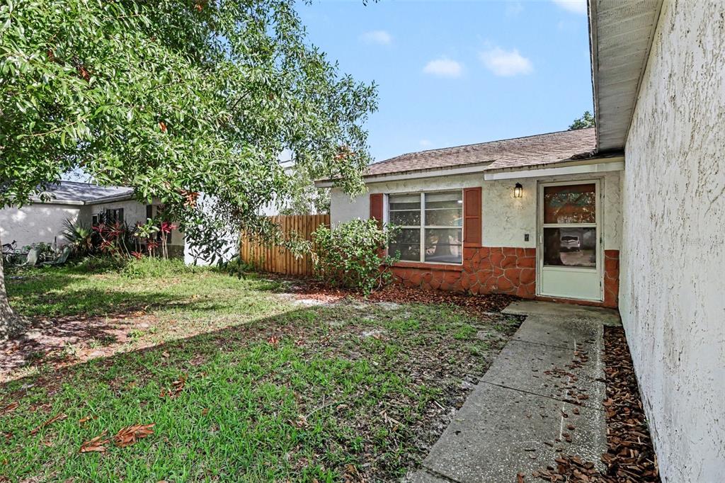 An empty room with white walls, a ceiling fan, and wood-look flooring — 1916 HUDSON COURT, OLDSMAR, FL