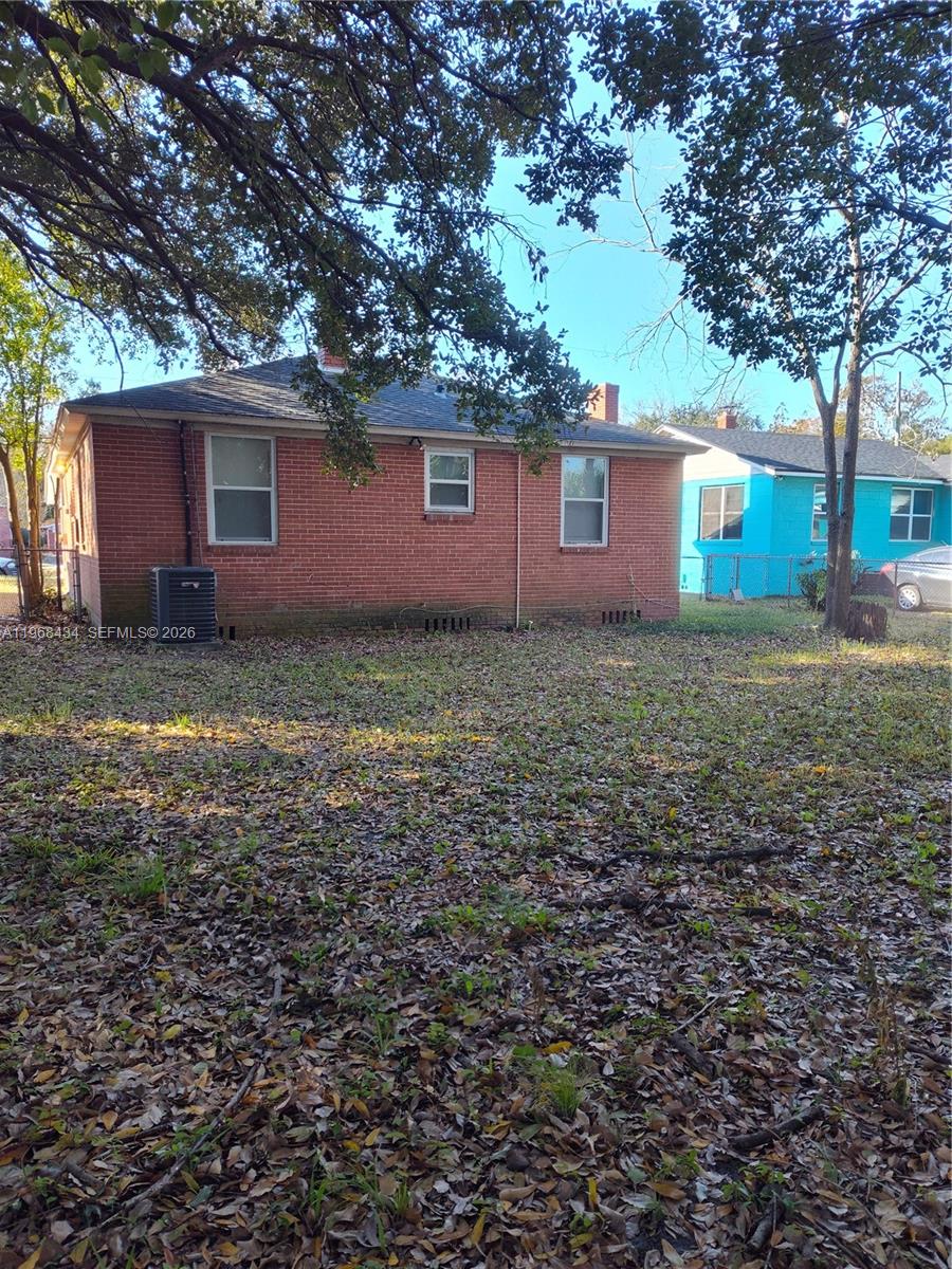 A brick house exterior with a large yard covered in fallen leaves — 1357 W 11TH, Jacksonville FL 32209, JACKSONVILLE, FL
