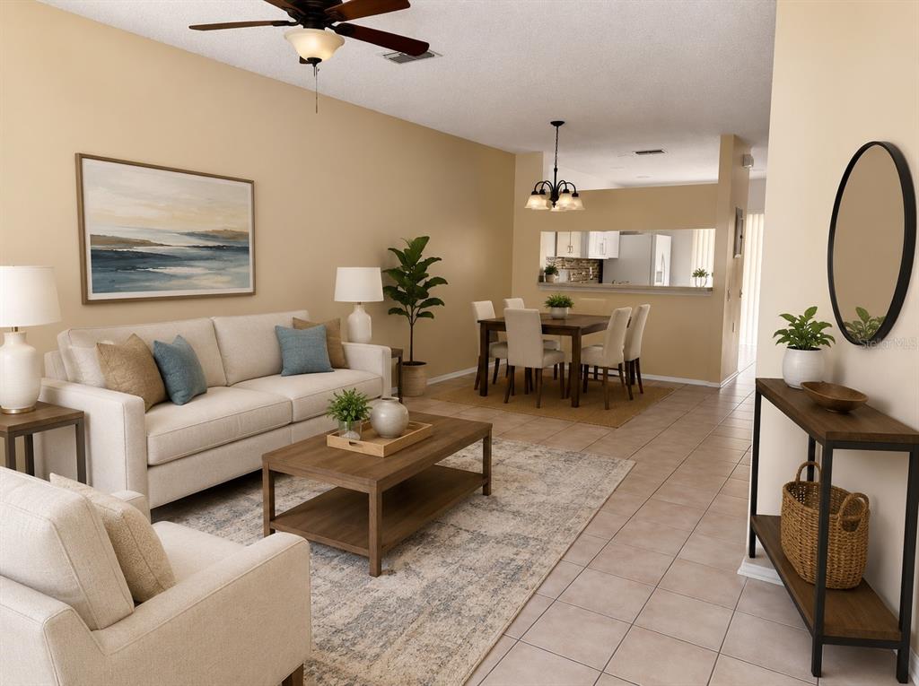 A living room and dining area with beige walls, tile floors, and neutral furniture — 29914 ALTA VITA LANE, WESLEY CHAPEL, FL