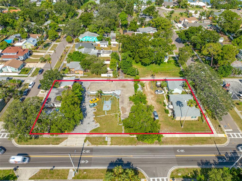 An aerial view shows a rectangular lot containing a commercial building and two residential houses — 416 PRINCESS STREET, CLEARWATER, FL