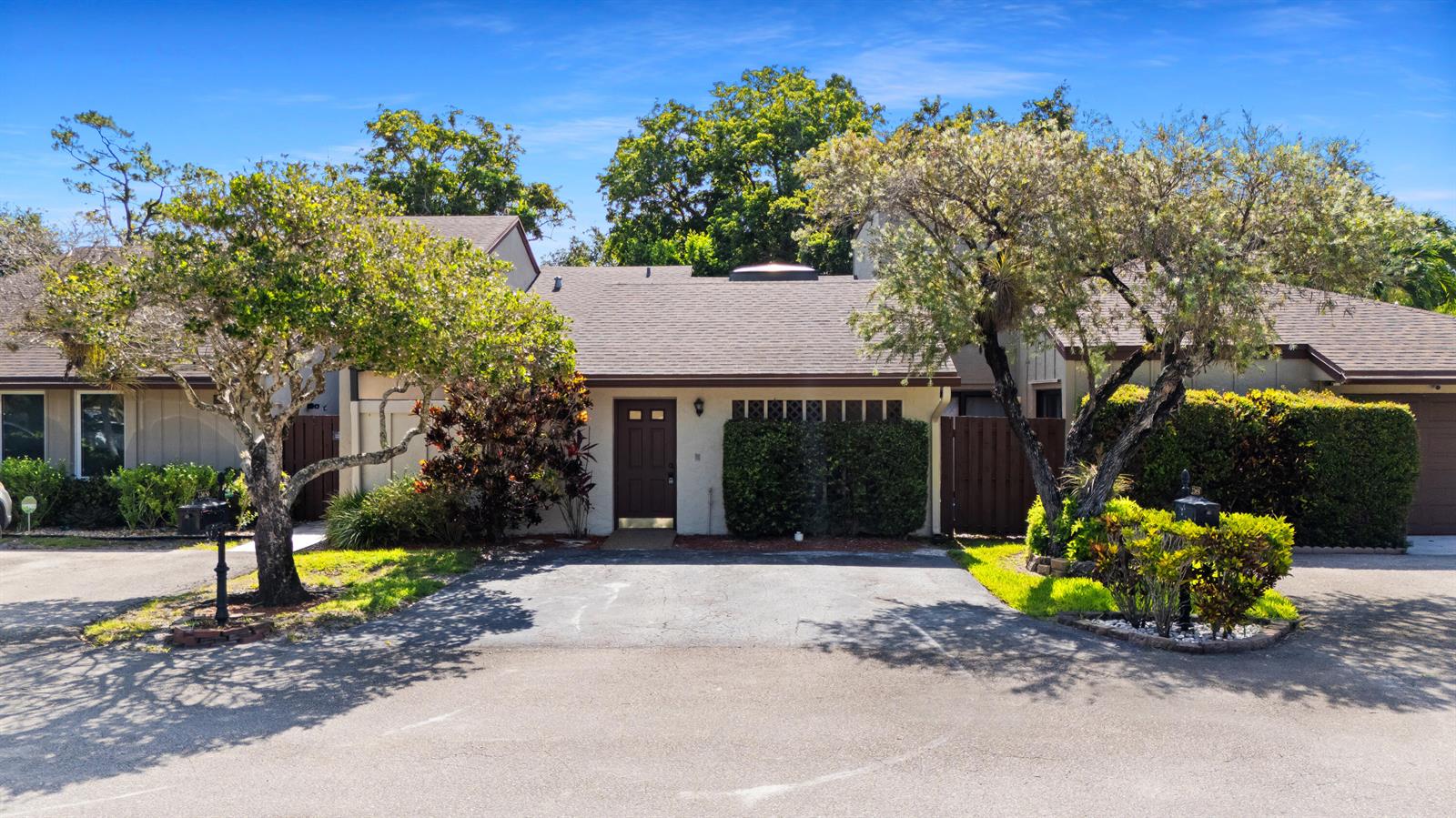 A single-story house with a brown roof, dark front door, and a paved driveway — 22656 Vistawood Way # 29d, Boca Raton FL 33428, BOCA RATON, FL