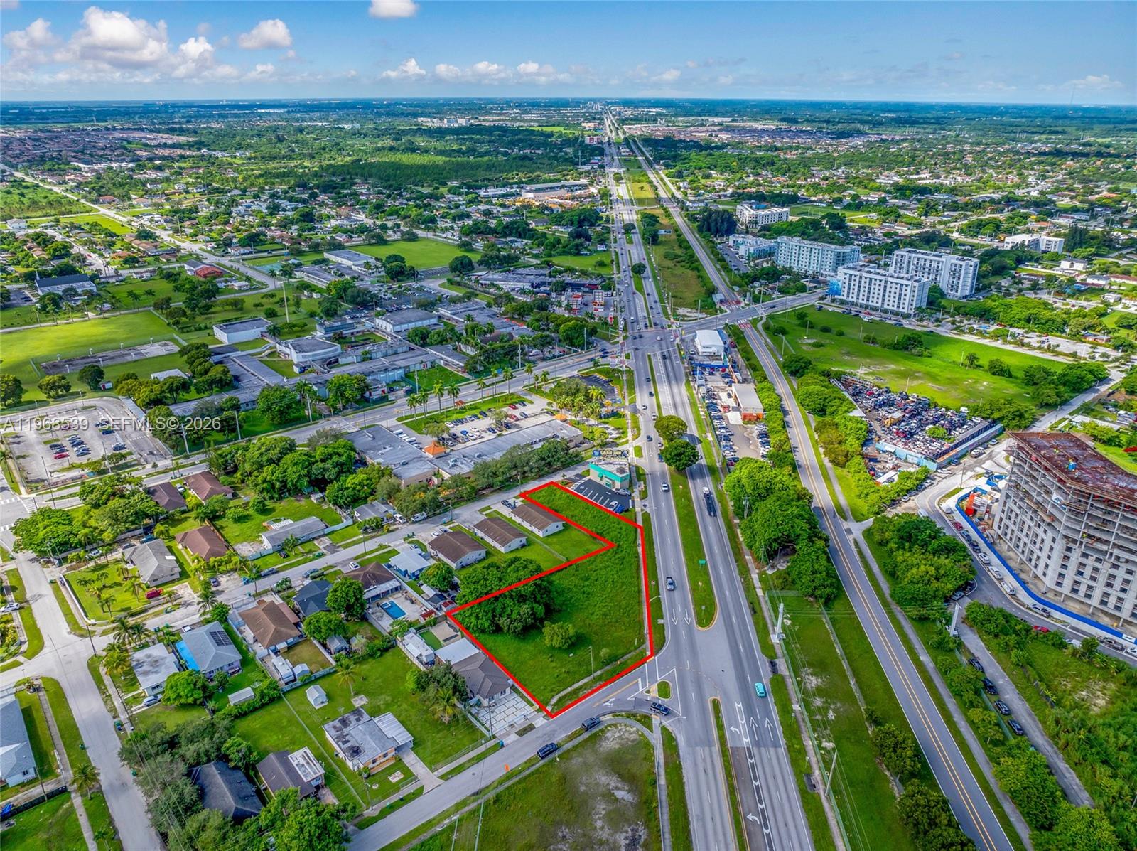 An aerial view shows a vacant lot outlined in red next to a major highway — 214 S Dixie Hwy, Miami FL 33189, MIAMI, FL