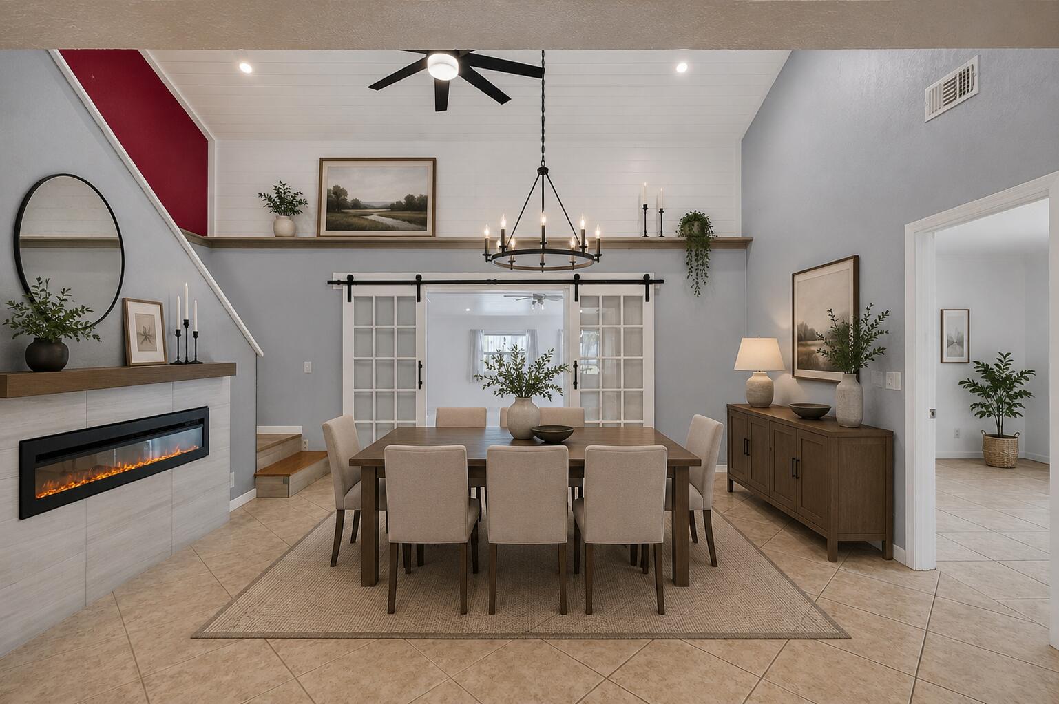 A dining room features a fireplace, a wooden table with six chairs, and sliding doors — 2388 Zeder Avenue, Delray Beach FL 33444, DELRAY BEACH, FL