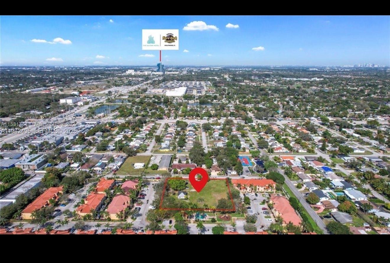 An aerial view shows a vacant rectangular lot outlined in red within a residential neighborhood — 5830 Liberty St, Hollywood FL 33021, HOLLYWOOD, FL