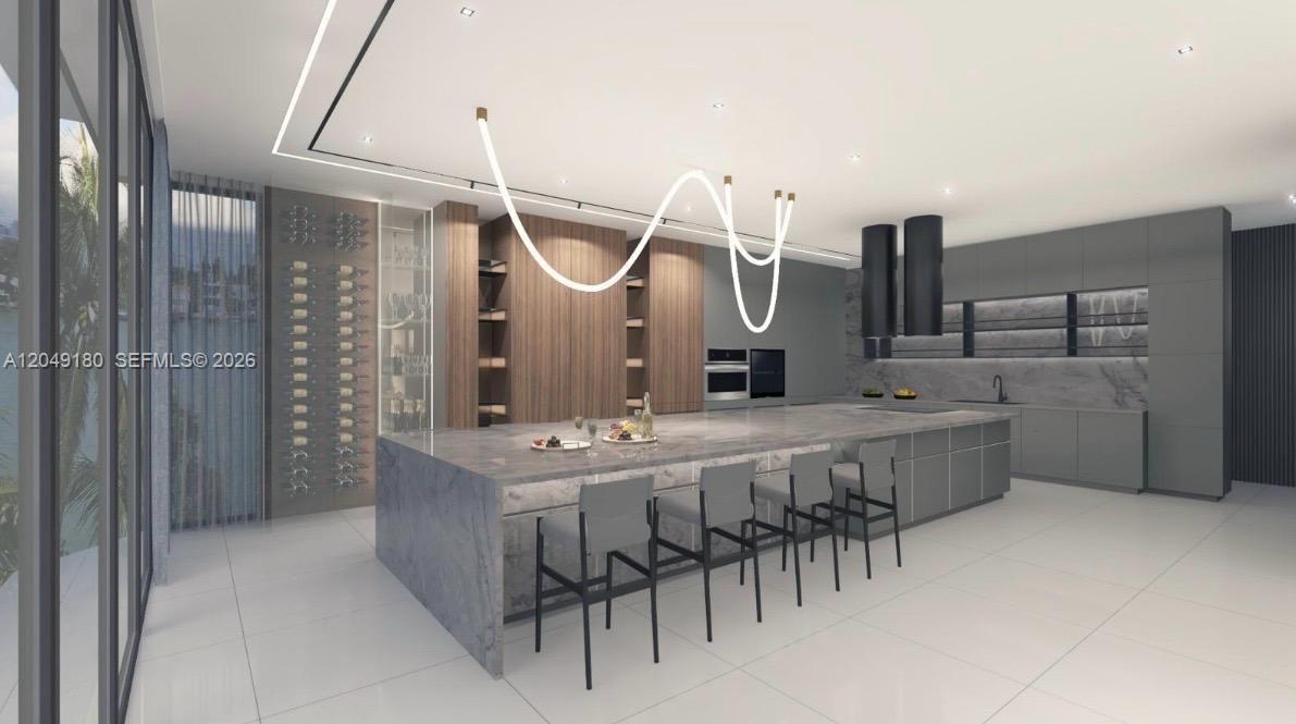 This rendering shows a modern kitchen with a large marble island and wood cabinetry — KEY LARGO, FL