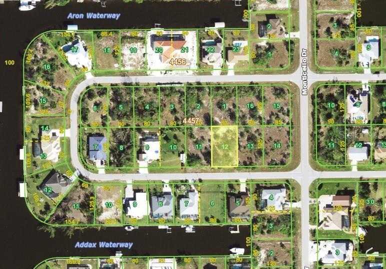 This is a satellite map showing residential lots and waterways in a suburban neighborhood — 15447 ARON CIRCLE, PORT CHARLOTTE, FL