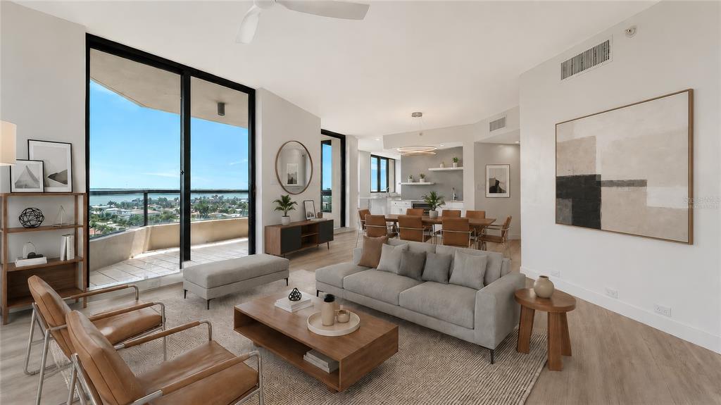 A modern living room with a sofa, coffee table, and balcony overlooking the water — 1211 GULF OF MEXICO DRIVE UNIT 701, LONGBOAT KEY, FL