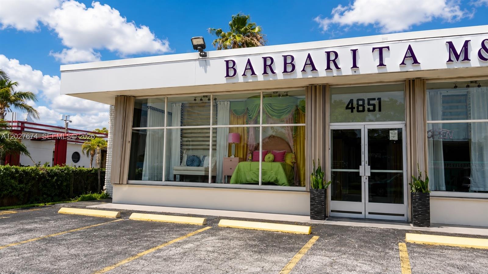 A commercial storefront features large display windows showcasing a bedroom set and a parking lot — 4851 E 8th Ave, Hialeah FL 33013, HIALEAH, FL