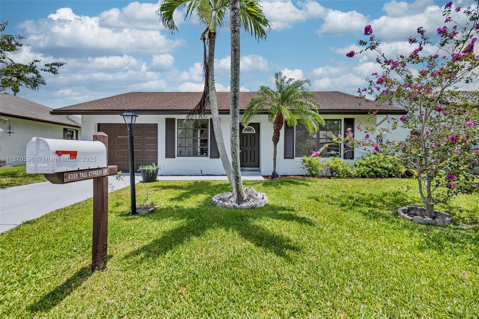 6338 Tall Cypress Cir, Green Acres FL 33463
