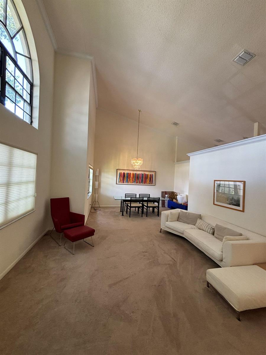A two-story tan house with a tile roof and a two-car garage — 3145 Peachtree Way, Davie FL 33328, DAVIE, FL