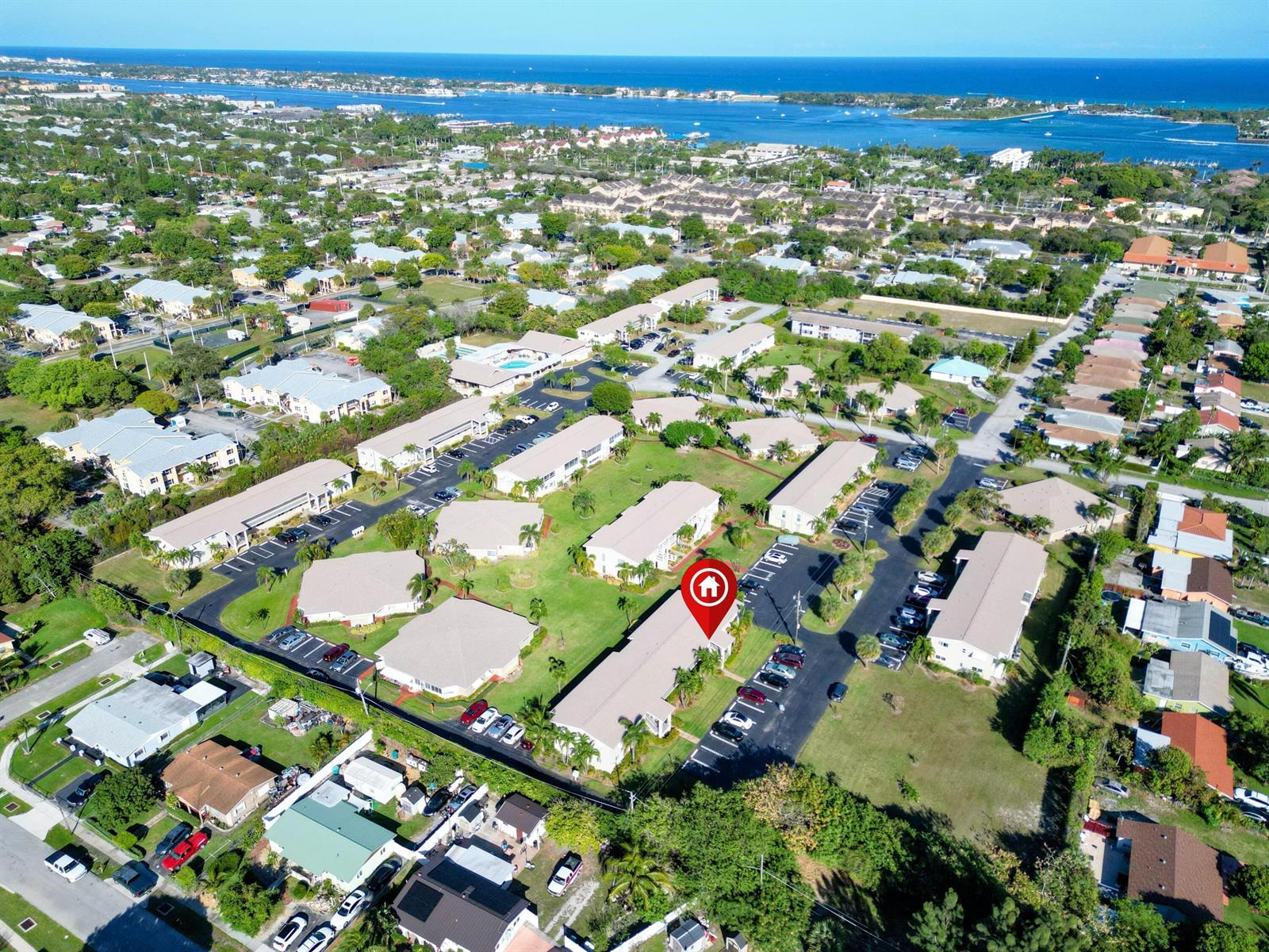 An aerial view shows a residential apartment complex with multiple buildings, parking lots, and green spaces — 301 Circle Drive S # 103, Boynton Beach FL 33435, BOYNTON BEACH, FL