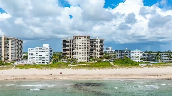 An aerial view of several high-rise apartment buildings situated along a sandy beach — 1800 S Ocean Boulevard # 403, Pompano Beach FL 33062, POMPANO BEACH, FL