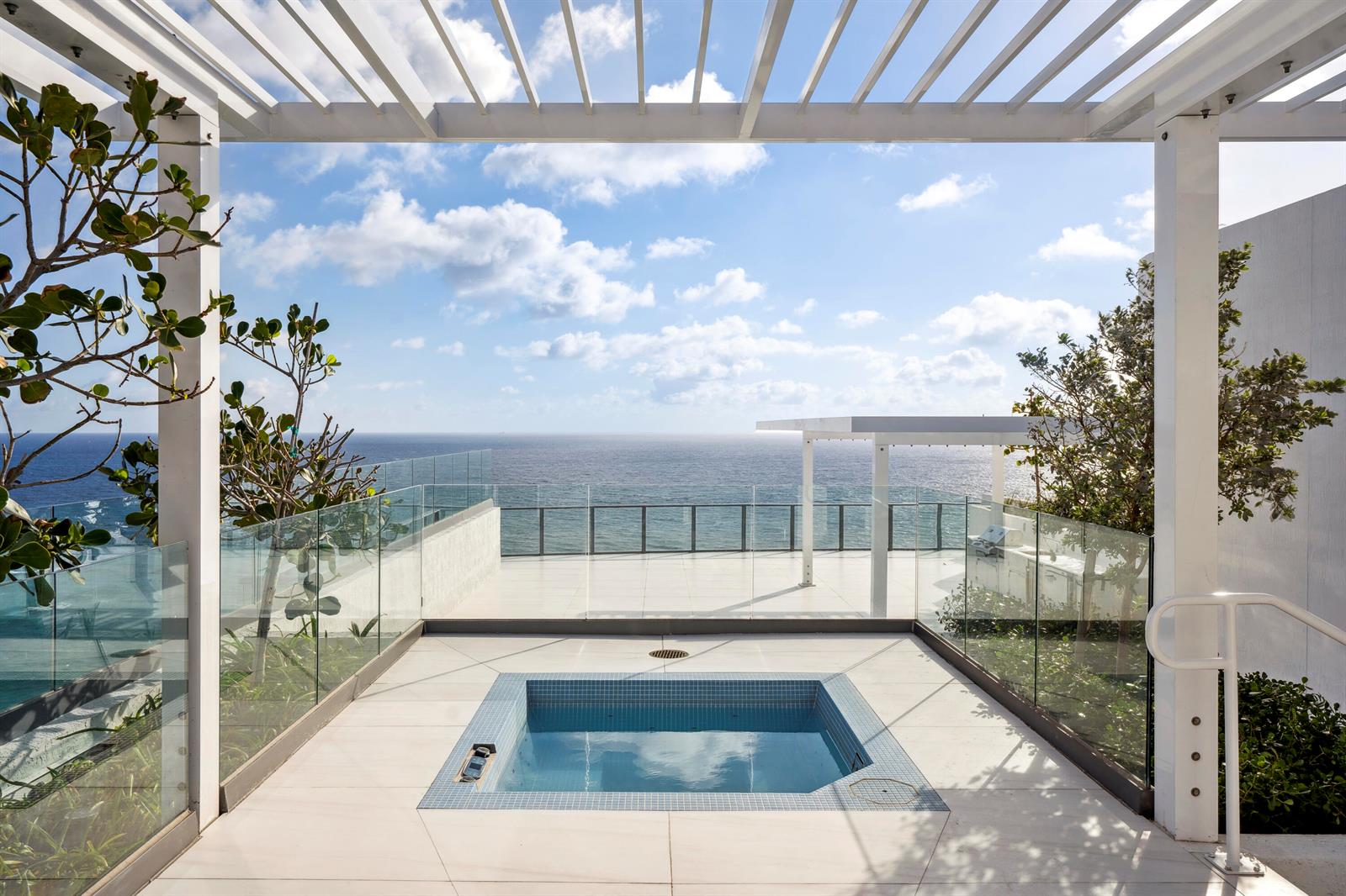 A rooftop terrace features a square plunge pool, glass railings, and an ocean view — 1116 N Ocean Boulevard, Pompano Beach FL 33062, POMPANO BEACH, FL