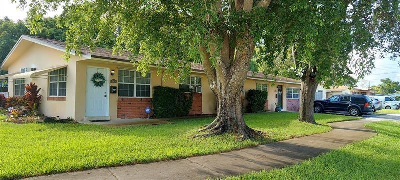 A single-story residential building with a brick facade and a large tree in the front yard — 738 SW 5th Avenue, Hallandale Beach FL 33009, HALLANDALE BEACH, FL