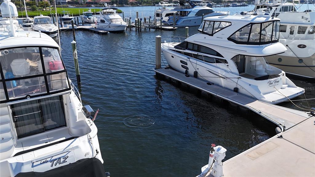 Several white yachts are docked in a marina on a sunny day — 102 RIVIERA DUNES WAY UNIT C-24, PALMETTO, FL