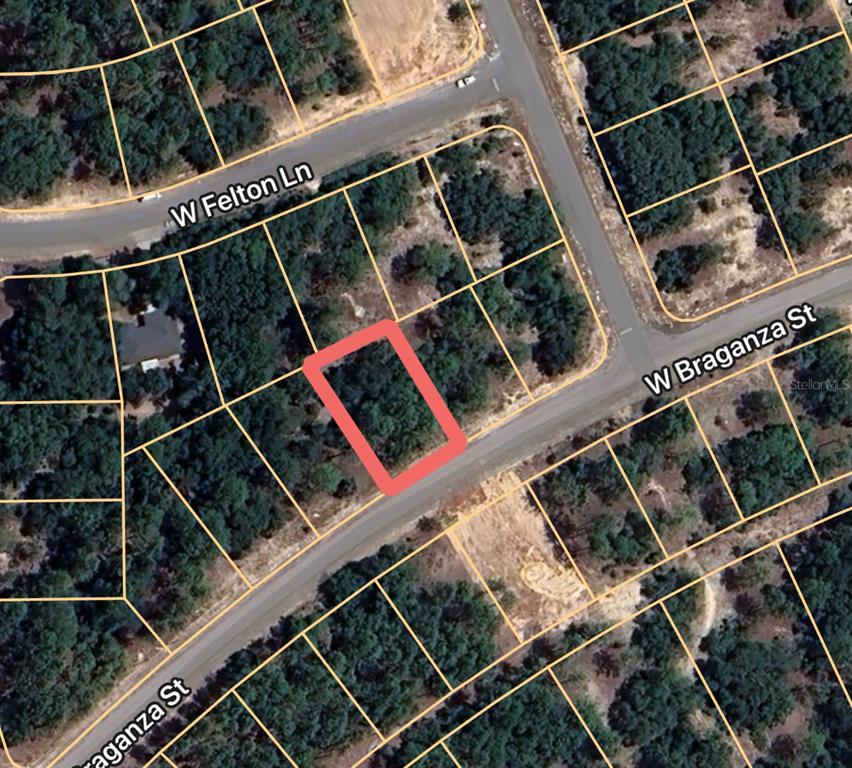 This is an aerial map view showing a vacant, rectangular lot outlined in red — 2641 W BRAGANZA STREET, DUNNELLON, FL