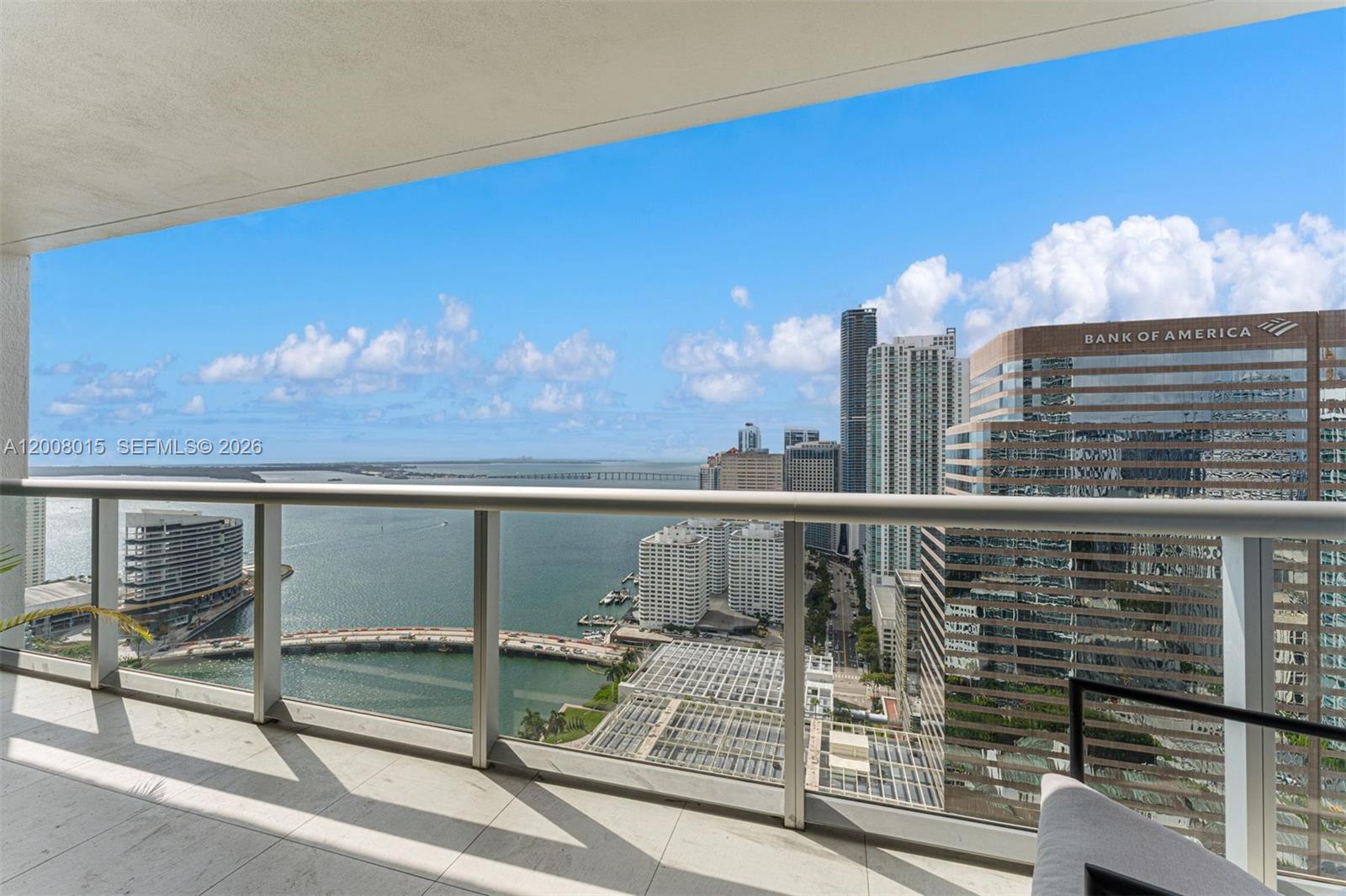 A high-rise balcony overlooks a bay, a bridge, and the Miami skyline — 495 Brickell Ave # 3509, Miami FL 33131, MIAMI, FL