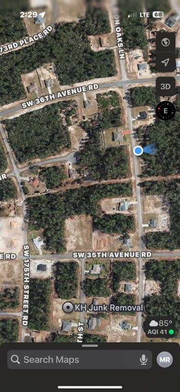 This is a satellite map view showing residential lots, wooded areas, and local roads — MARION OAKS LANE, OCALA, FL