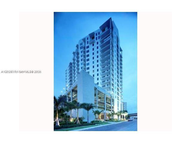 A tall, modern residential high-rise building with a multi-level parking garage at its base — 10 SW South River Dr # 801, Miami FL 33130, MIAMI, FL