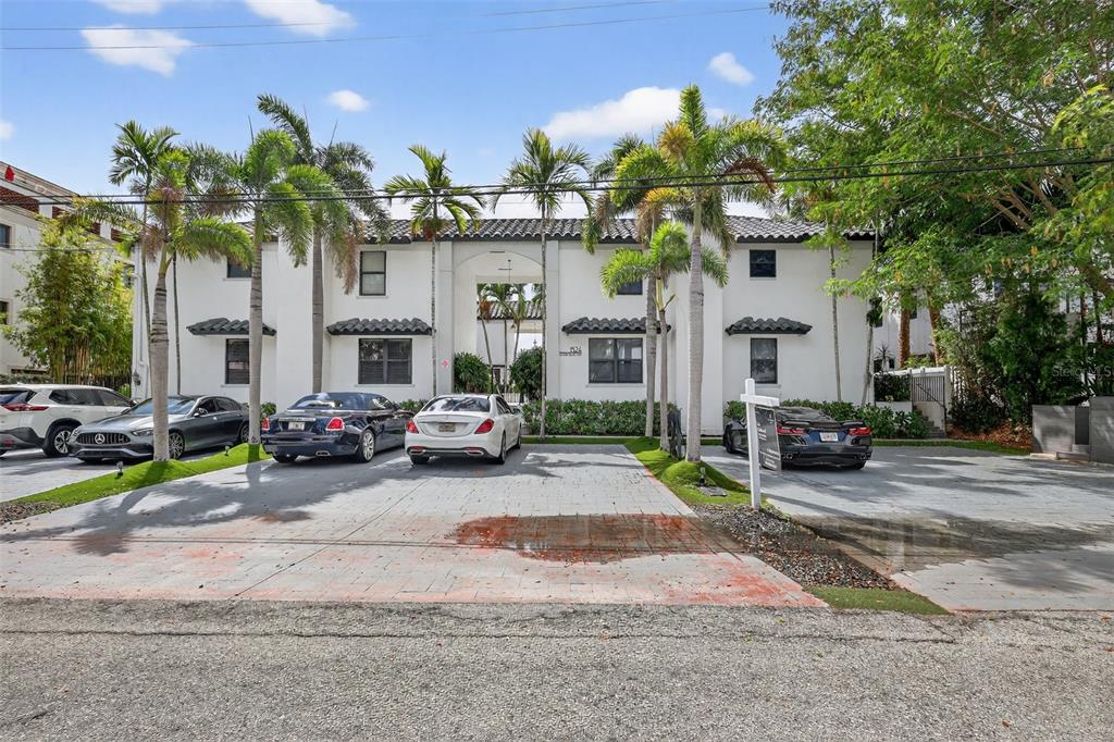 A two-story white building with a tiled roof and palm trees in front — 1524 SE 12TH STREET UNIT 6, FORT LAUDERDALE, FL