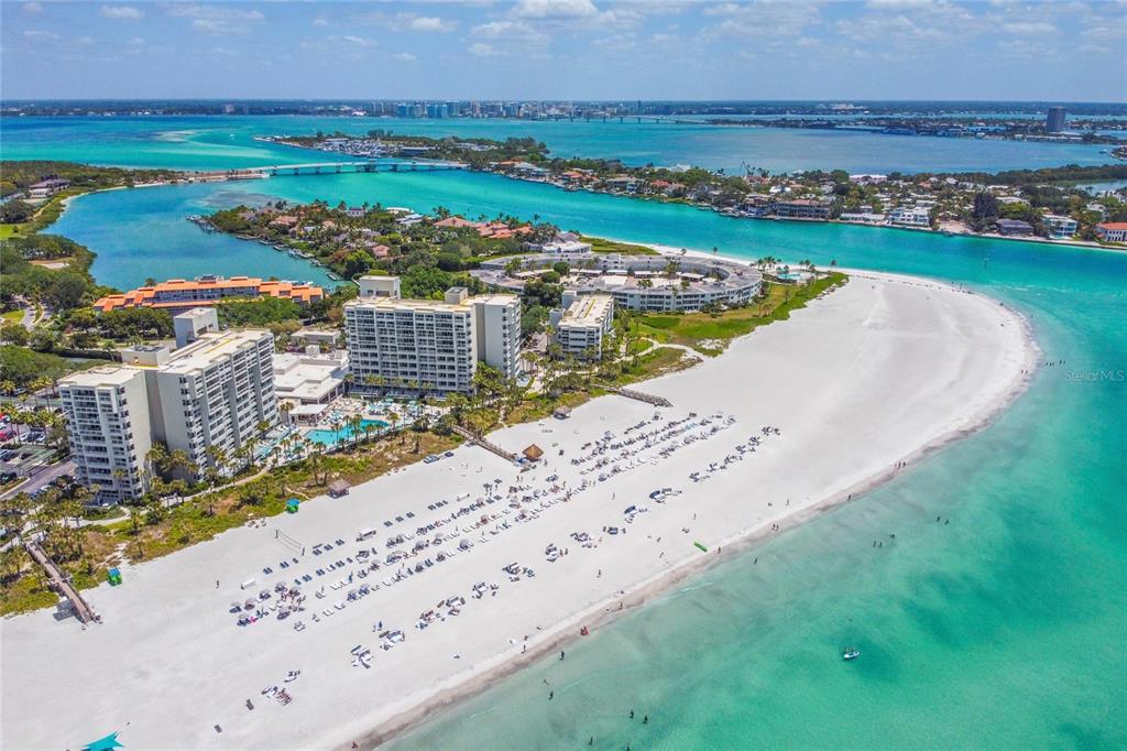 An aerial view of a white sand beach with high-rise condominiums and turquoise water — 240 SANDS POINT ROAD UNIT 4102, LONGBOAT KEY, FL