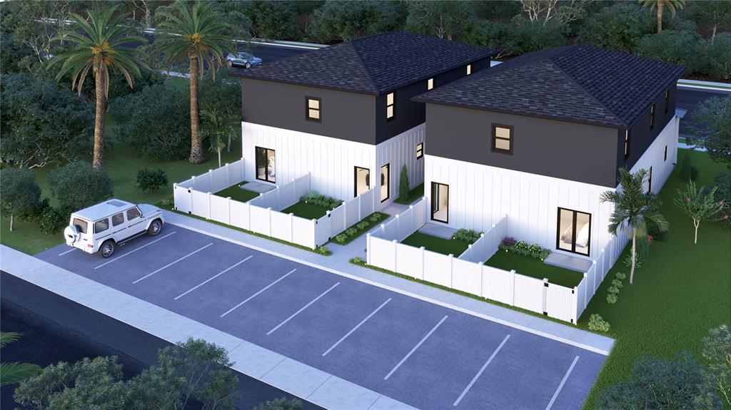 This is a digital rendering of two modern two-story townhomes with private fenced yards and parking — 3540 1ST AVENUE S, ST PETERSBURG, FL