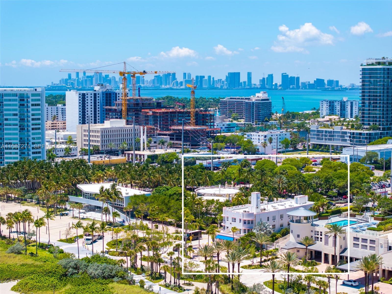 An aerial view shows a park with palm trees, a building, and a swimming pool — 7300 Ocean Ter, Miami Beach FL 33141, MIAMI BEACH, FL