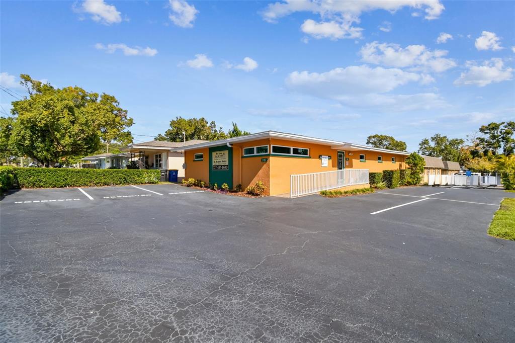 A single-story orange commercial building with a parking lot and a white handicap ramp — 321 S LINCOLN AVENUE, CLEARWATER, FL
