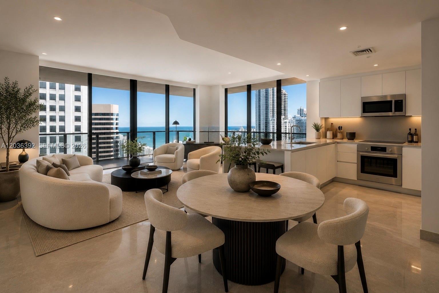 An open-concept living and dining area features floor-to-ceiling windows with ocean and city views — 68 SE 6th St # 3301, Miami FL 33131, MIAMI, FL