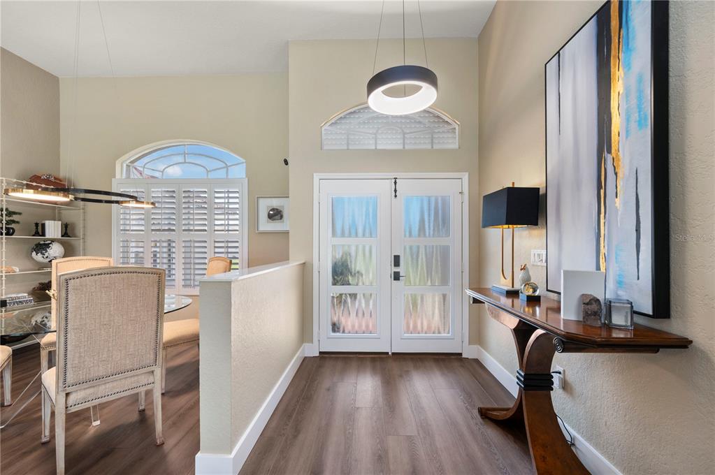 A single-story house with a tile roof, a three-car garage, and a concrete driveway — 1512 SUZI STREET, PUNTA GORDA, FL