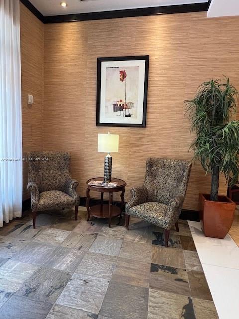 Two patterned armchairs flank a small wooden table with a lamp against a textured wall — 510 NW 84th Ave # 534, Plantation FL 33324, PLANTATION, FL