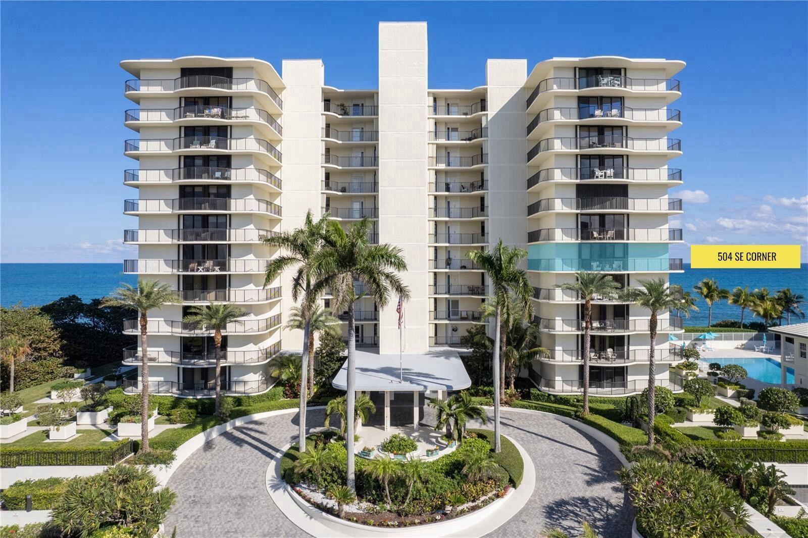 An exterior view of a multi-story residential building with balconies and a circular driveway — 400 Beach Road # 504, Tequesta FL 33469, TEQUESTA, FL