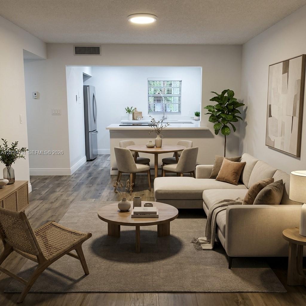 This is a rendering of an open-concept living and dining area with neutral furniture — 7755 SW 86th St # 107, Miami FL 33143, MIAMI, FL