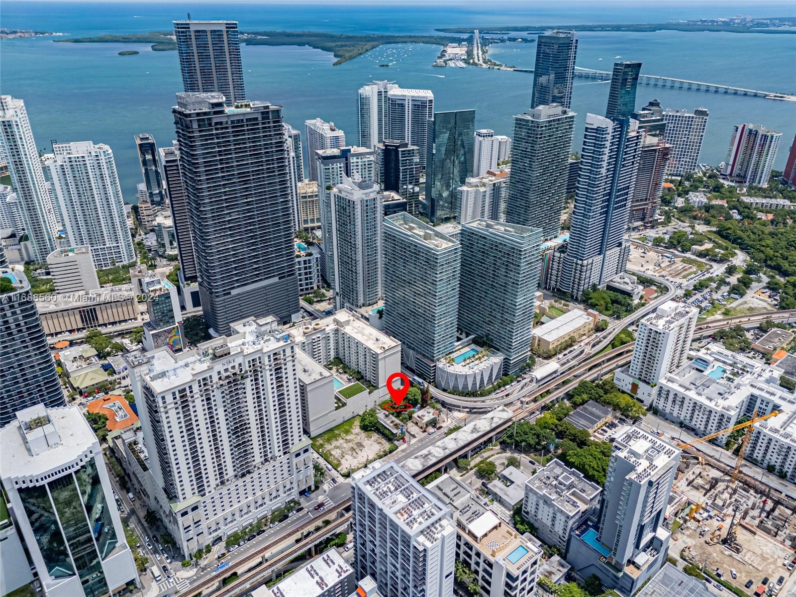 This aerial view shows a red pin marking a vacant lot in downtown Miami — 75 SW 11th St, Miami FL 33130, MIAMI, FL