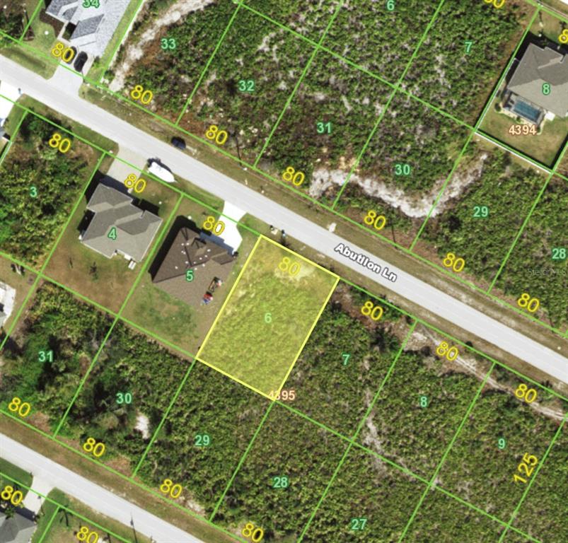 This is an aerial map showing a vacant residential lot highlighted in yellow on a street — 13485 ABUTILON LANE, PORT CHARLOTTE, FL