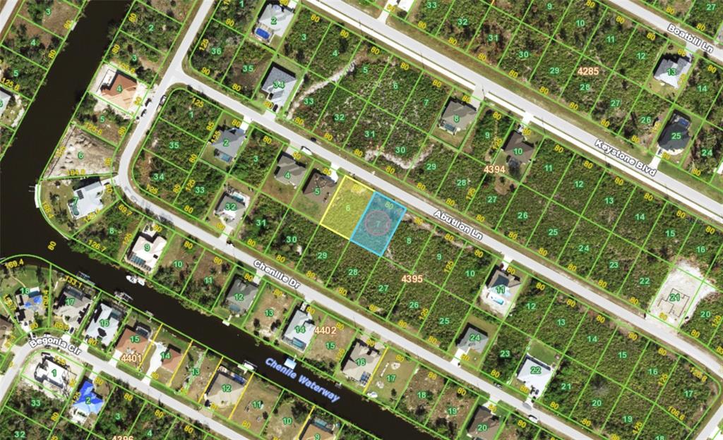 This is an aerial map showing residential lots and streets in a suburban neighborhood — 13485 ABUTILON LANE, PORT CHARLOTTE, FL