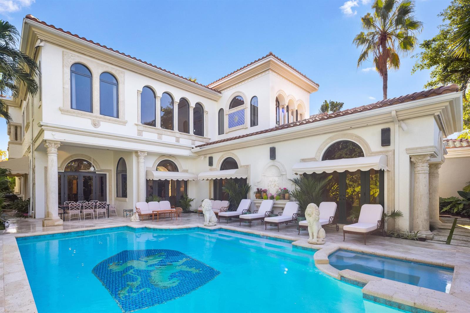 A two-story Mediterranean-style house with a swimming pool, patio furniture, and stone lion statues — 422 Addison Park Lane, Boca Raton FL 33432, BOCA RATON, FL