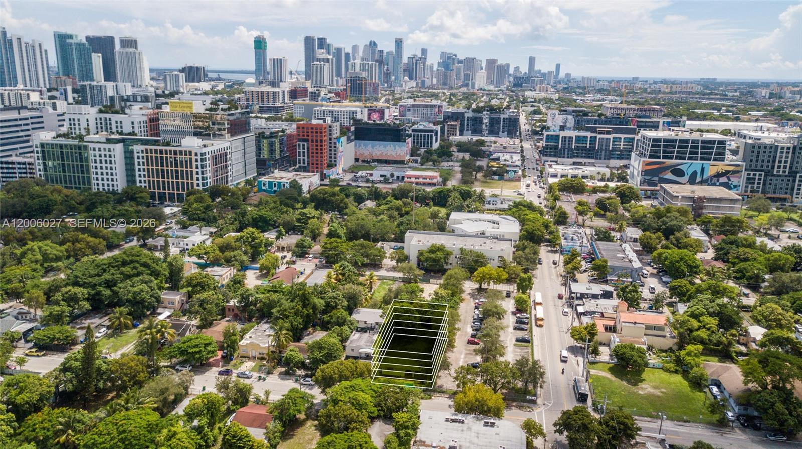 An aerial view shows a vacant rectangular lot outlined in white amidst urban greenery — 178 NW 32nd St, Miami FL 33127, MIAMI, FL