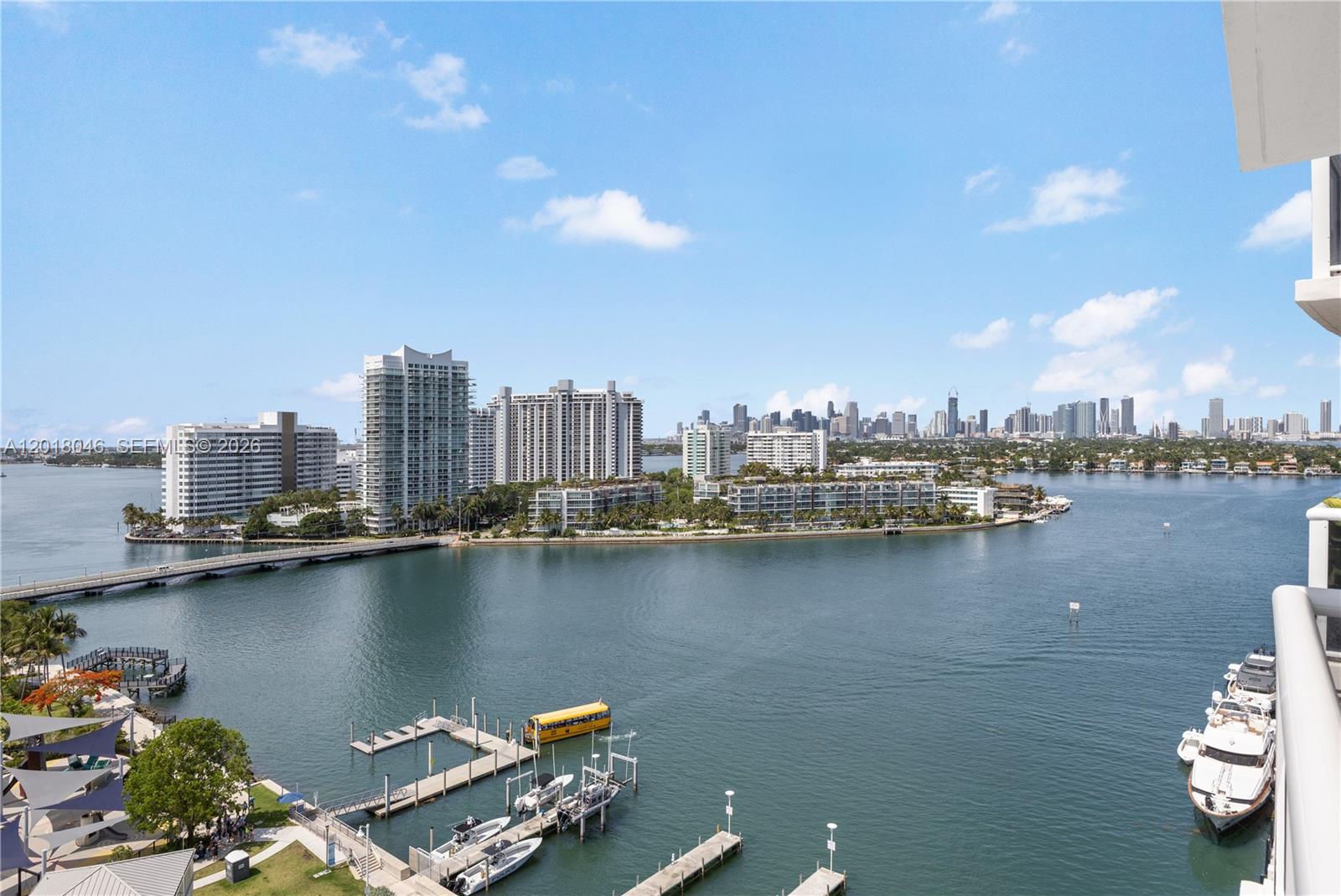 An elevated view shows a marina, a bridge, and high-rise buildings across the water — 1800 Sunset Harbour Dr # 1601, Miami Beach FL 33139, MIAMI BEACH, FL