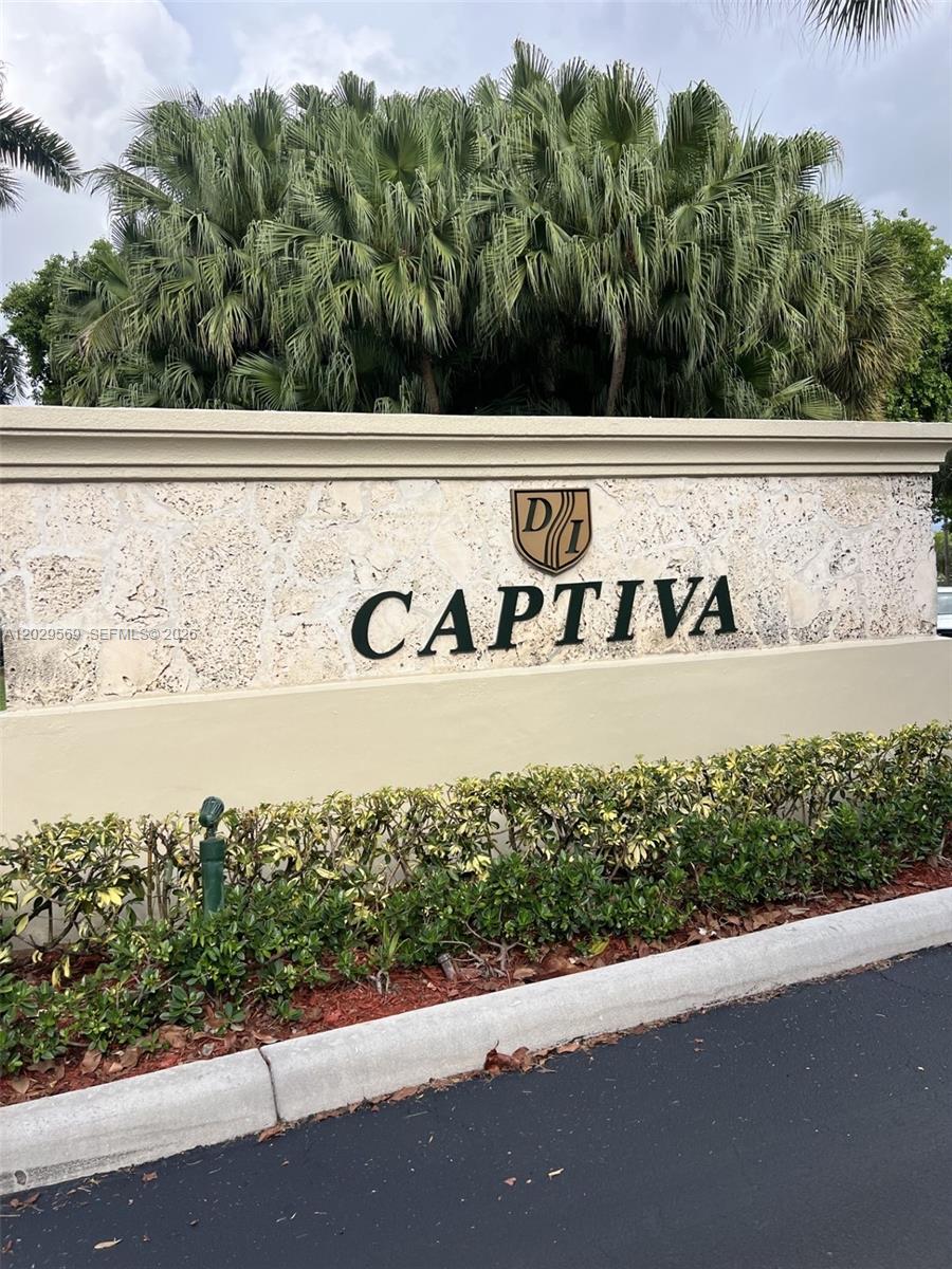A stone monument sign for Captiva stands in front of lush palm trees and landscaping — 10750 NW 66th St # 401, Doral FL 33178, DORAL, FL