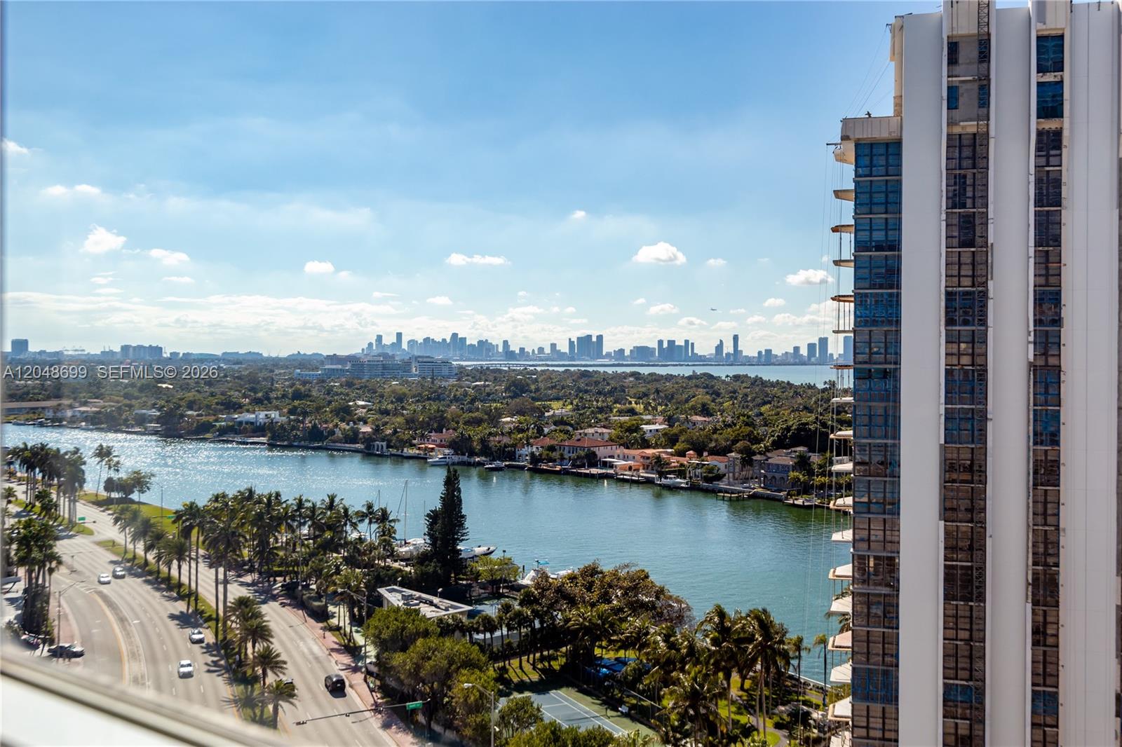 An elevated view shows a waterway, a coastal city skyline, and a high-rise building — 5445 Collins Ave # 1108, Miami Beach FL 33140, MIAMI BEACH, FL