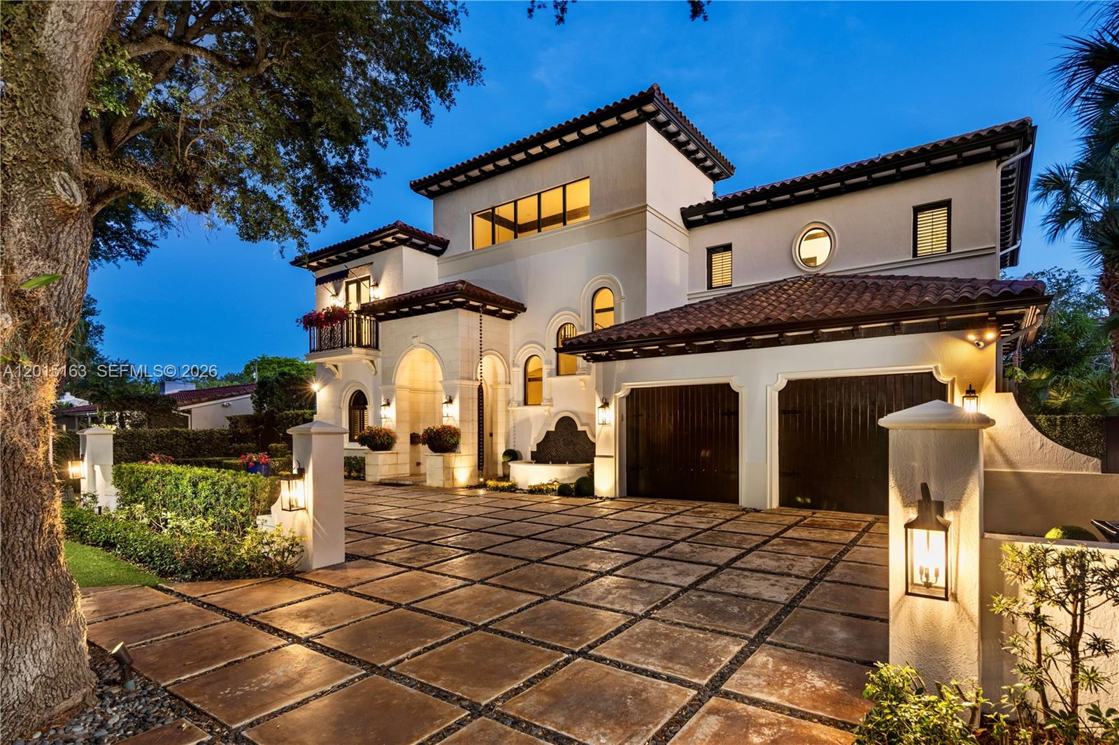 A two-story Mediterranean-style house features a tiled roof, a paved driveway, and a garage — 5838 SW 50th St, Miami FL 33155, MIAMI, FL
