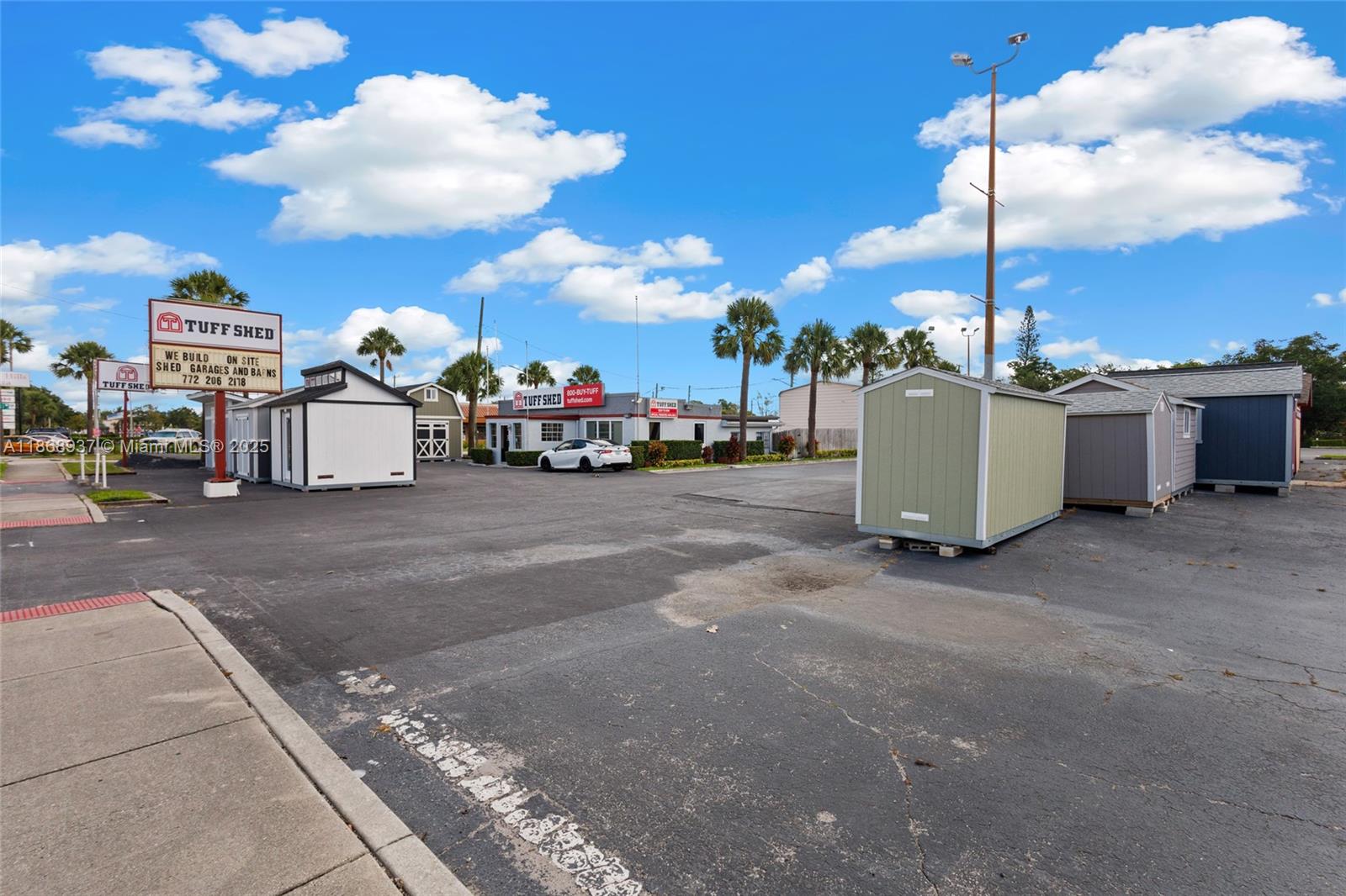 An outdoor lot displays several Tuff Shed structures and a sales office under a blue sky — 2402 S US HWY 1, Fort Pierce FL 34982, FORT PIERCE, FL