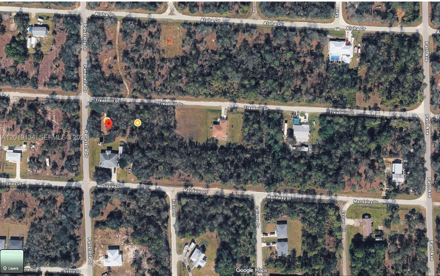 This is a satellite map view of a wooded residential area with several streets — PUNTA GORDA, FL