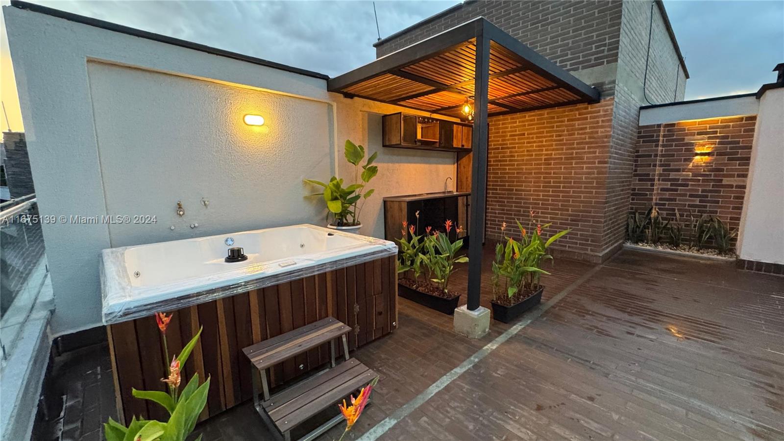 A rooftop terrace features a hot tub, a covered outdoor kitchen, and potted plants — Colombia-Cl 36d Sur #24-57 # 424, AN 055427, AN