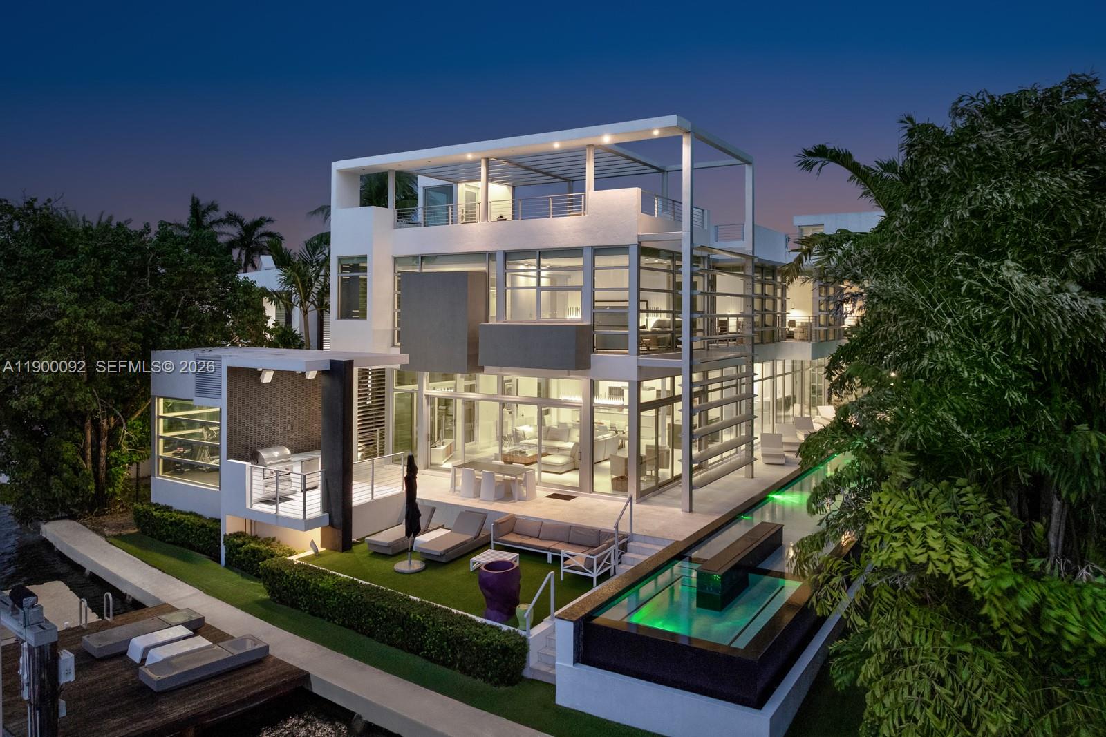 A modern three-story waterfront home features a swimming pool, outdoor patio, and private dock — 440 S Hibiscus Dr, Miami Beach FL 33139, MIAMI BEACH, FL