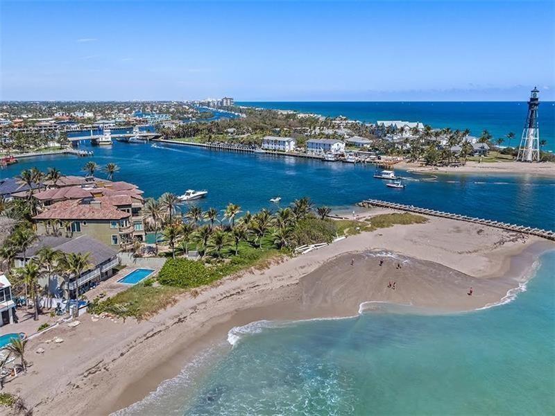 An aerial view of a beach, a lighthouse, and a waterway with boats and buildings — 2600 N Riverside Drive, Pompano Beach FL 33062, POMPANO BEACH, FL
