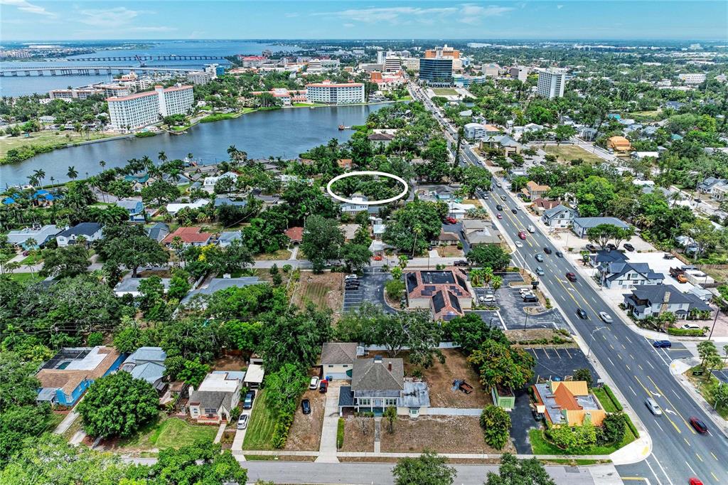 An aerial view shows a residential neighborhood with a white oval highlighting a specific property — 405 20TH STREET W, BRADENTON, FL