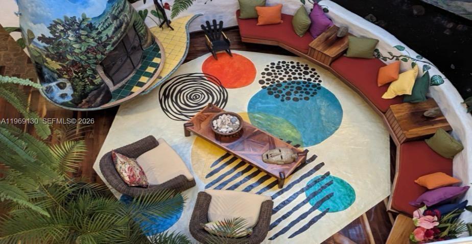 A high-angle view of a circular living room featuring a large patterned area rug — Santa Barbara de Heredia, Costa Rica, 00000, FL
