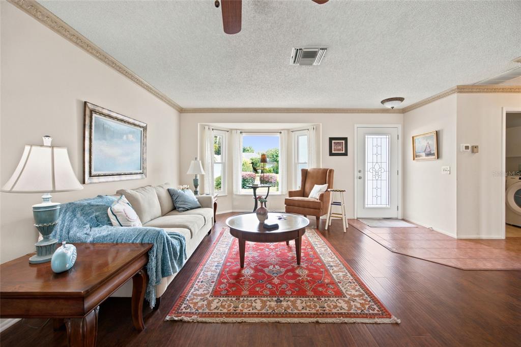 A screened-in swimming pool and patio area adjacent to a house with sliding glass doors — 2292 WHISPER WALK DRIVE, SPRING HILL, FL